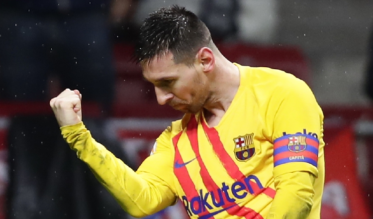 Leo Messi celebra su noveno gol en el campeonato español de primera división. Foto AP