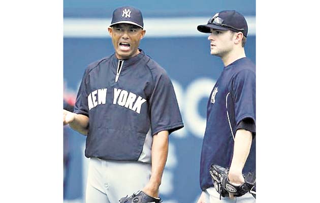 Dave Robertson (der.) junto a Mariano Rivera la campaña pasada.(AP)