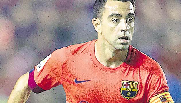 Xavi Hernández durante un partido de la Liga.(EFE)