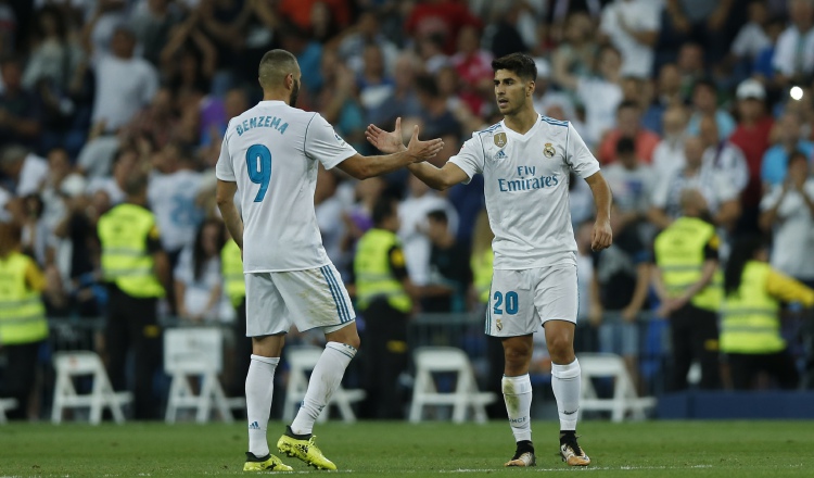 Marco Asensio (derecha), anotó los dos goles del Madrid. /Foto AP
