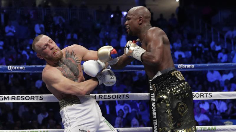 “Pelea” entre Mayweather Jr.y Conor McGregor. Foto AP