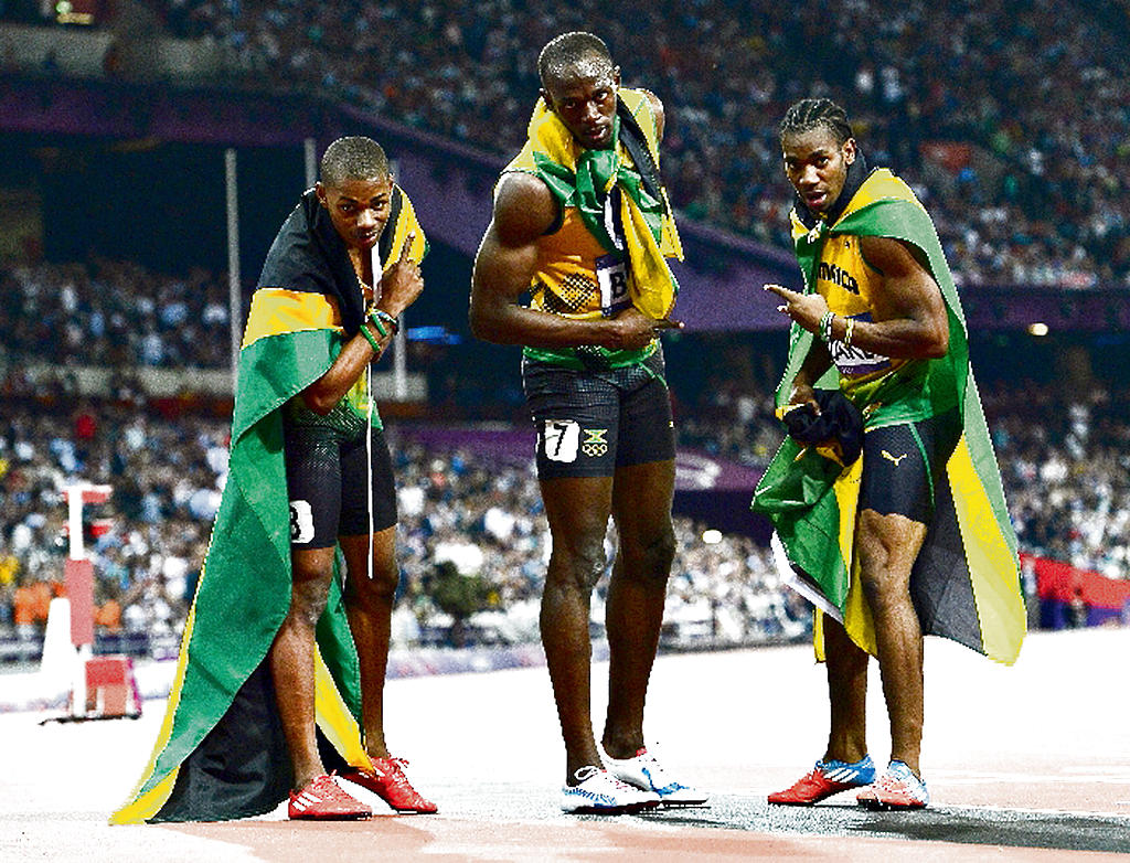 Trio. Bolt (centro.), Blake y Weir completaron el podio.(EFE)