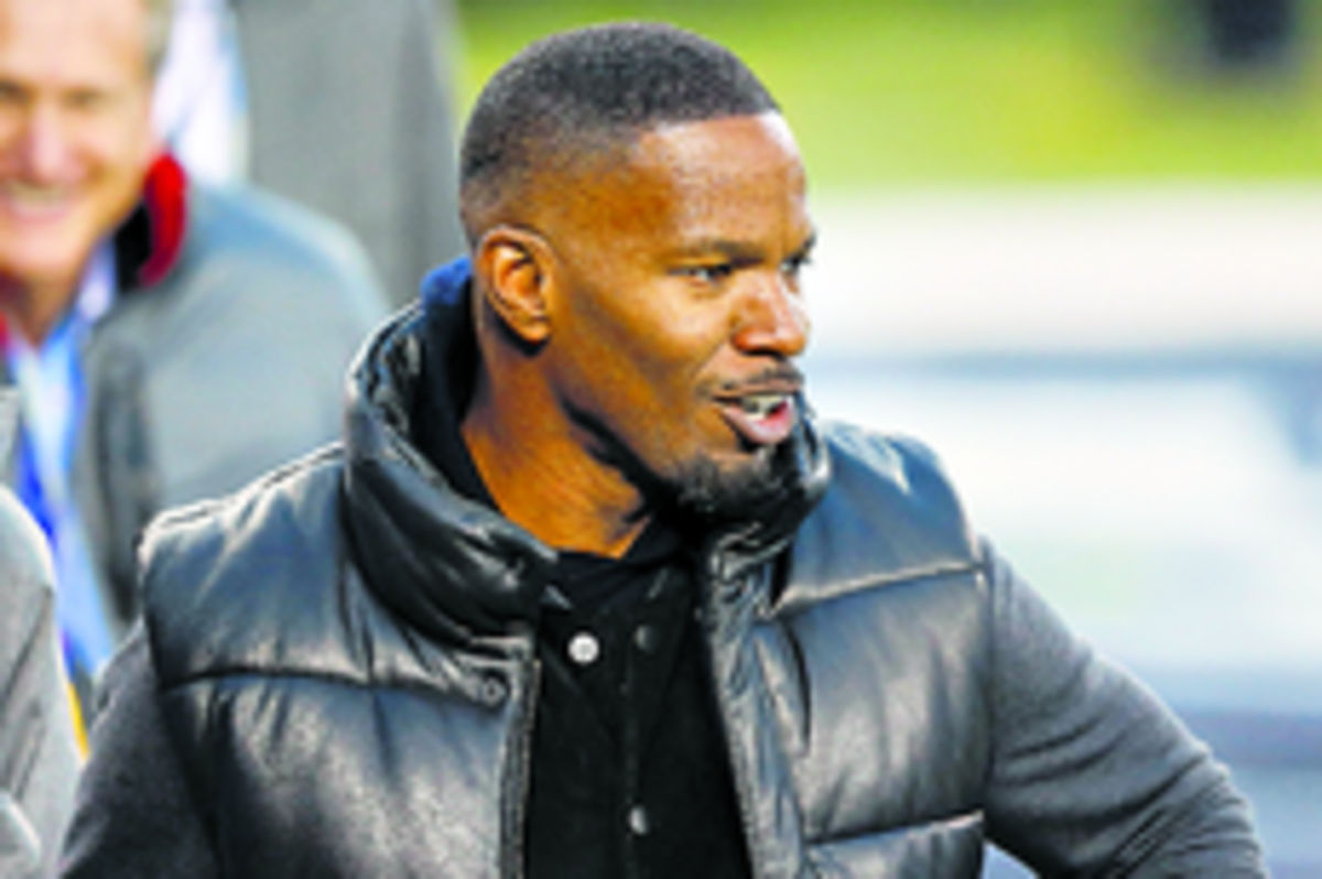 Famosos asistieron a la cita. El actor y cantante ganador del Óscar, Jamie Foxx, fue una de las tantas figuras del espectáculo que acudió a la final de Super Bowl 2014.(AP)