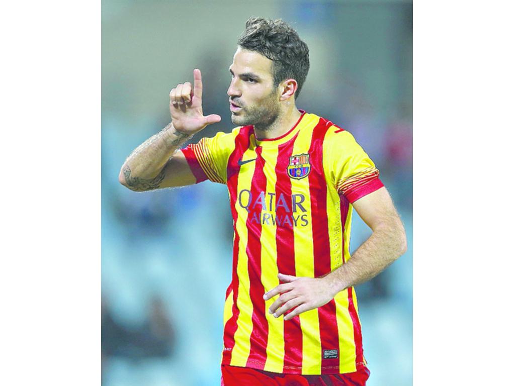 Cesc Fàbregas, jugador del Barcelona, convirtió dos goles.(AP)