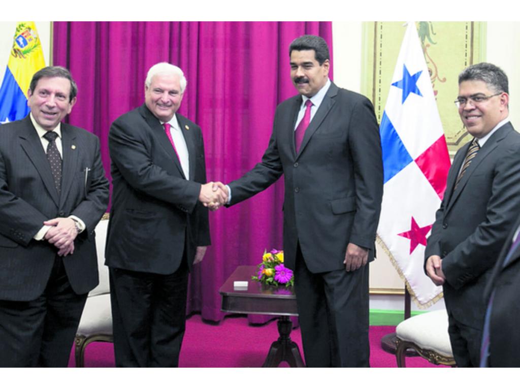 El presidente Martinelli durante su reunión con Maduro.(EFE)