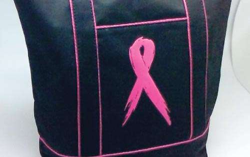 <p>Variedad. Bolso con el símbolo de la campaña en un tono fucsia con fondo negro.</p>