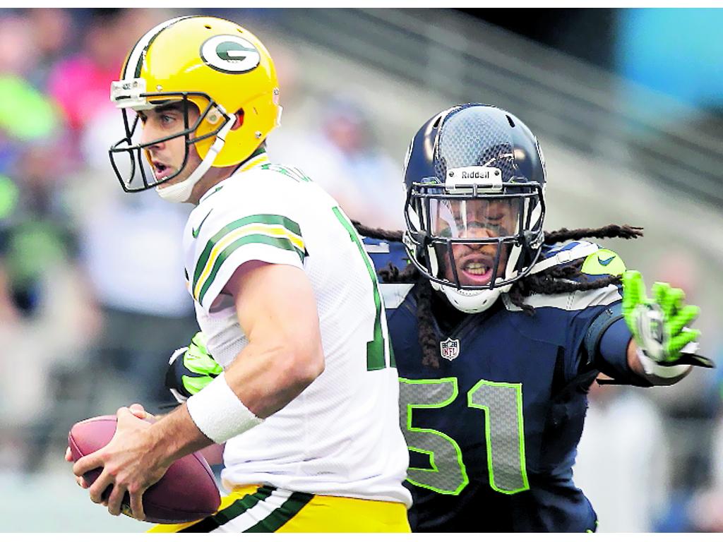 Triste. Aaron Rodgers (izq.) no ha tenido buen arranque.(AP)