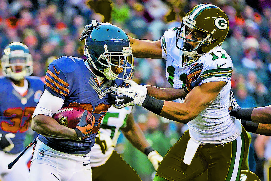 Poder. Devin Hester (izq.) intenta escaparse. ()