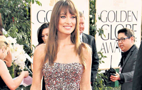 <p>Olivia Wilde. El vestido de Marchesa que llevó en los Globos de Oro siempre será recordado. De escote palabra de honor y recubierto de strass.</p>