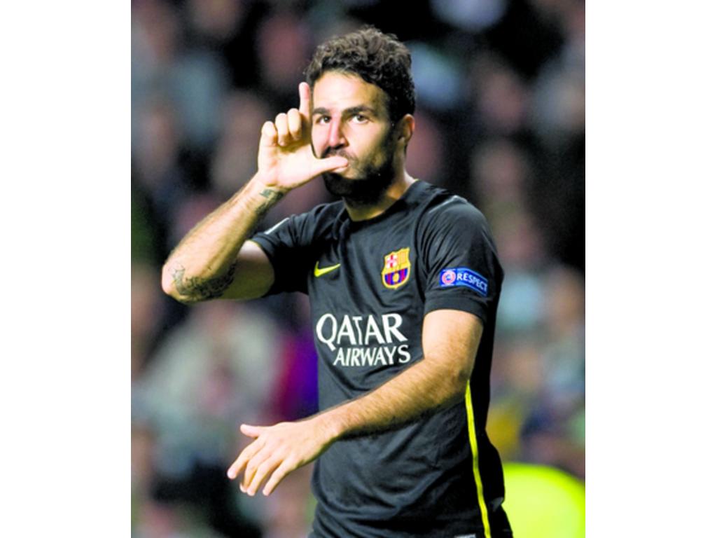 El centrocampista Cesc Fàbregas celebra tras marcar ayer ante el Celtic.(EFE)