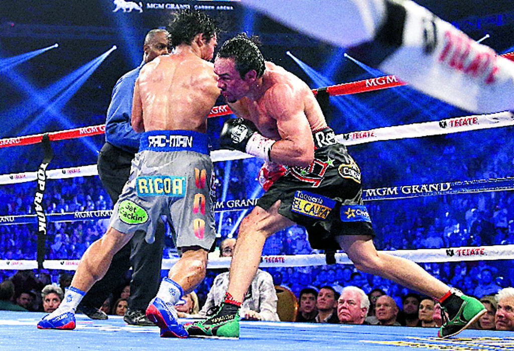 Poder. Márquez noqueó a Pacquiao (izq.) en Las Vegas. (archivo)