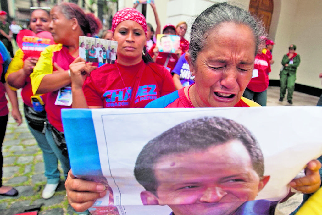 Tristeza Lloran y extrañan al comandante.(EFE)