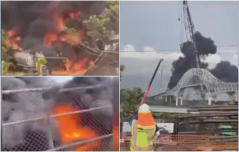 Bomberos tratan de evitar el fuego alcance estructura del Puente de Las Américas y buscan a un desaparecido