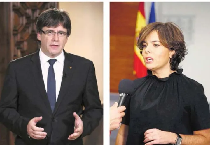 Carles Puigdemon (i), presidente catalán y  Soraya Sáenz de Santamaría (d), vicepresidenta de España. /Foto EFE