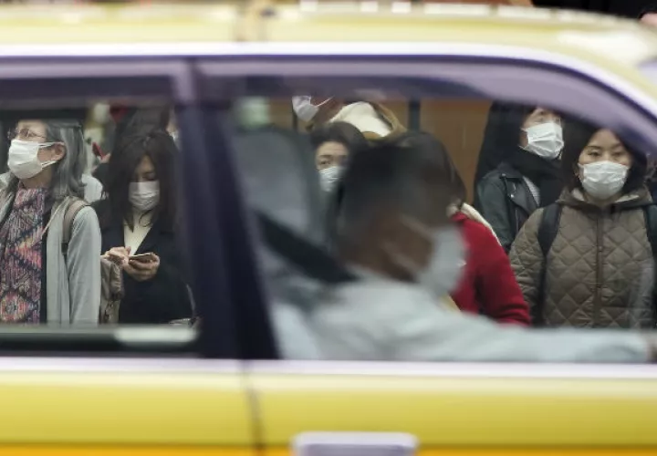 Negocios hacen planes para evitar la propagación del coronavirus. Una calle en Tokio. Foto / Eugene Hoshiko/Associated Press.